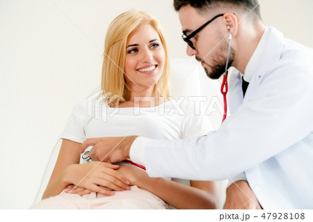 Male Doctor and Female Patient in Hospital Office Male Doctor and Female Patient in Hospital Office 47928108