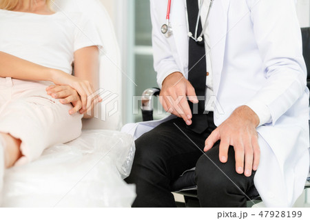 Male Doctor and Female Patient in Hospital Office Male Doctor and Female Patient in Hospital Office 47928199
