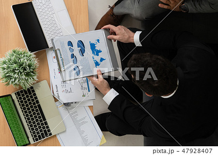 Businessmen are in business meeting in office. 47928407
