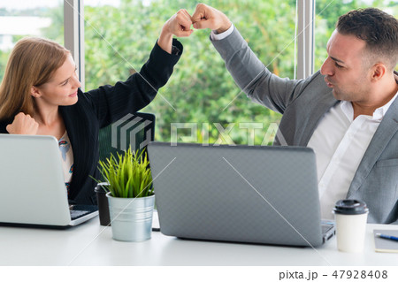 Success business partner celebrating in office. Success business partner celebrating in office. 47928408