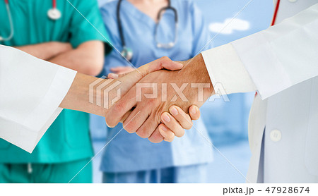 Doctor working in hospital with other doctors. 47928674