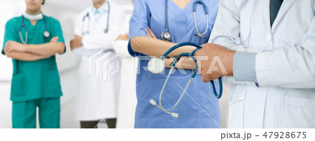 Doctor working in hospital with other doctors. Doctor working in hospital with other doctors. 47928675