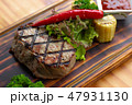 Barbecue meat steak with red hot pepper, herb, corn and tomato sauce on wooden board. Grilled steak 47931130