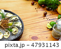 Oysters cooked with cheese and herbs on wooden copy space. Seafood composition. Italian cuisine with 47931143