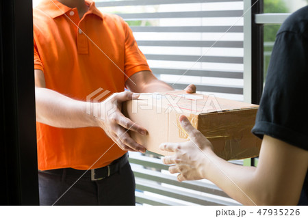 Woman hand accepting a delivery of boxes 47935226