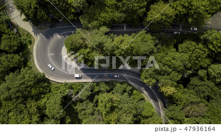 Aerial view of cars on a curvy road in mountain Aerial view of cars on a curvy road in mountain 47936164