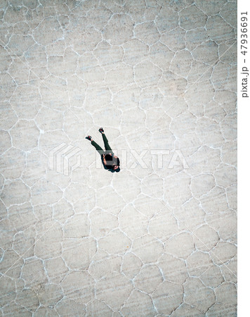Man flyind a drone in Uyuni Bolivia 47936691