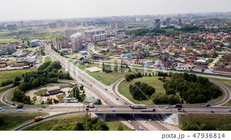 Aerial view of highway and overpass in city on a cloudy day 47936814