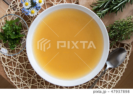 Bone broth made from chicken served in a plate Bone broth made from chicken served in a plate 47937898