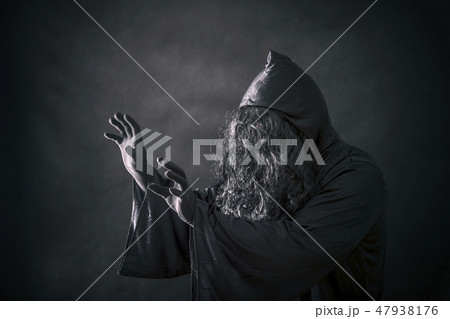 The witch in hooded cloak  47938176