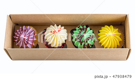 4 cupcakes colorful in the box. 4 cupcakes colorful in the box. 47938479