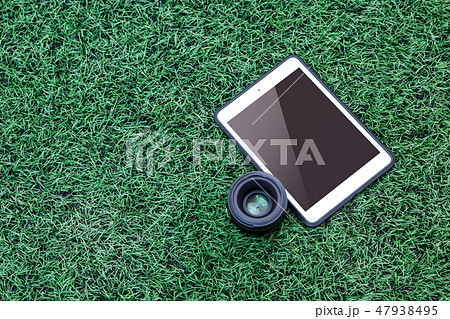 The photographer's tabloid placed on the lawn. The photographer's tabloid placed on the lawn. 47938495