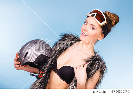 Nice lady having fun with winter accessories. 47939276