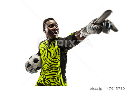 One soccer player goalkeeper isolated on white background One soccer player goalkeeper isolated on white background 47945750