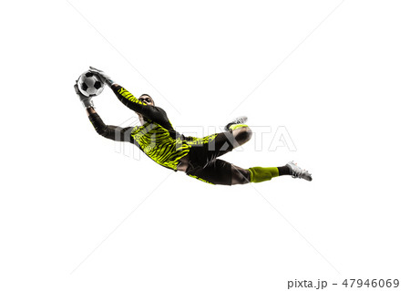 One soccer player goalkeeper man catching ball One soccer player goalkeeper man catching ball 47946069