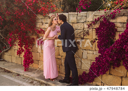 Man and woman together walking and kissing  47948784