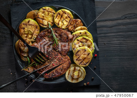 top view of cutting grilled wagyu beef roast  47950067