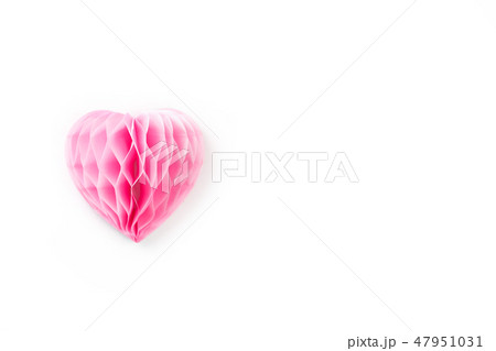A lush pink paper heart on a white background. A lush pink paper heart on a white background. 47951031