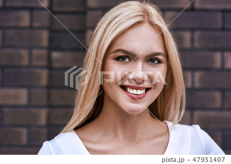 Portrait of smiling blonde woman Portrait of smiling blonde woman 47951407