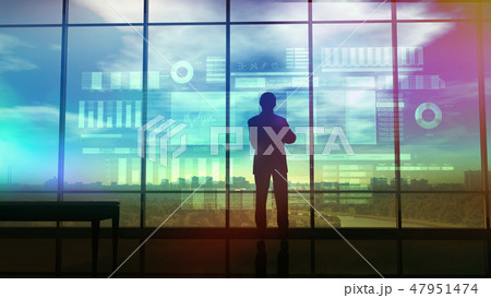 Silhouette of a trader in the office before infographics Silhouette of a trader in the office before infographics 47951474