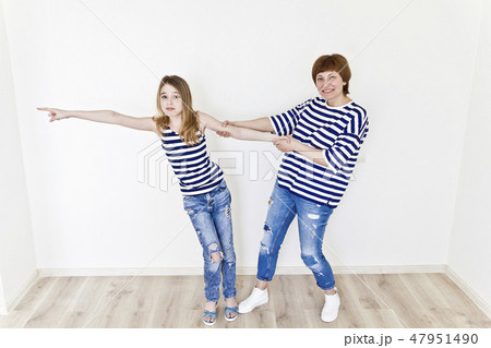 Beautiful mother and daughter on white Beautiful mother and daughter on white 47951490