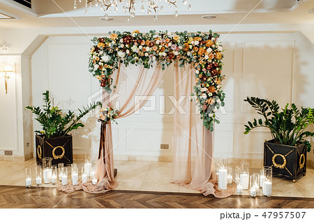 Wedding reception decoration with different electric edison lamps and fresh flowers, rustic style 47957507