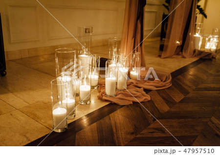 Luxury, fashion wedding decoration wedding, restaurant. Candle in glasses Luxury, fashion wedding decoration wedding, restaurant. Candle in glasses 47957510