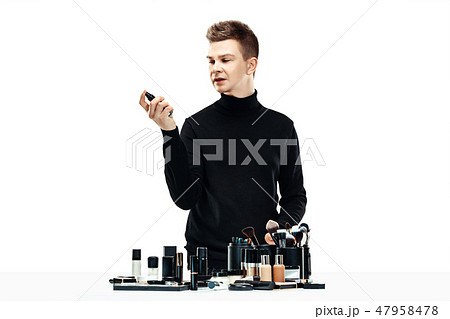Professional makeup artist isolated on white 47958478