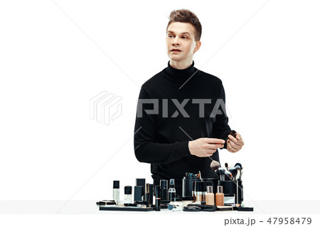 Professional makeup artist isolated on white 47958479