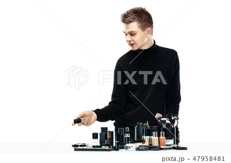 Professional makeup artist isolated on white 47958481