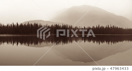Foggy mountain lake Foggy mountain lake 47963433