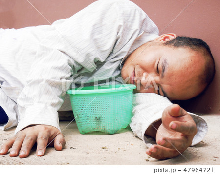 Homeless man sleeping and sadness on street. Homeless man sleeping and sadness on street. 47964721