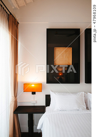 Asian contemporary hotel room with bed white sheet Asian contemporary hotel room with bed white sheet 47968109