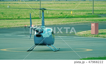 Small blue helicopter ready for take off from the airport 47968222
