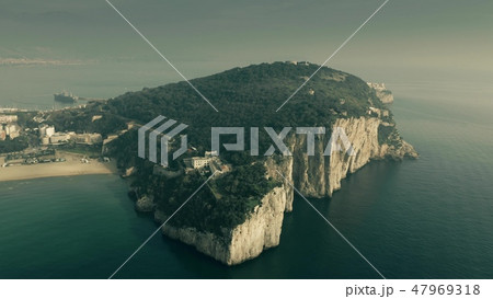 Aerial view of the Montagna Spaccata or Broken Mountain, a sharply vertical cliff, in Gaeta, Italy 47969318