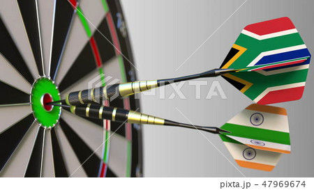 Flags of South Africa and India on darts hitting bullseye of the target. International cooperation 47969674