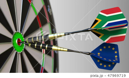 Flags of South Africa and the European Union on darts hitting bullseye of the target. International Flags of South Africa and the European Union on darts hitting bullseye of the target. International 47969719