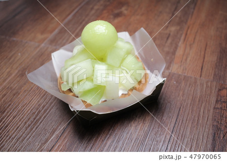 White melon cake on wooden plate 47970065