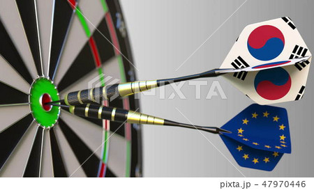 Flags of South Korea and the European Union on darts hitting bullseye of the target. International Flags of South Korea and the European Union on darts hitting bullseye of the target. International 47970446
