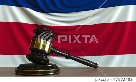 Judge's gavel and block against the flag of Costa Rica. National court conceptual 3D rendering 47972482