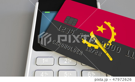 Payment terminal with credit card featuring flag of Angola. Angolan national banking system 47972626