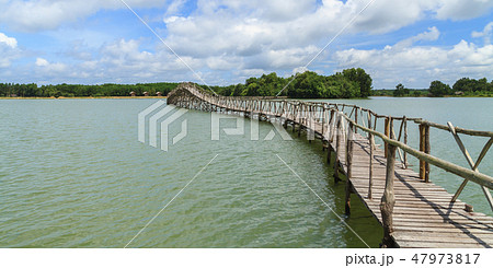 Wooden bridge across reservoir. Wooden bridge across reservoir. 47973817