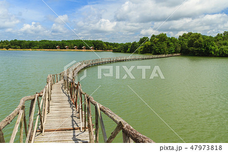 Wooden bridge across reservoir. Wooden bridge across reservoir. 47973818