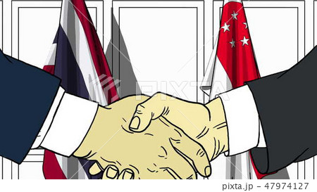 Businessmen or politicians shake hands against flags of Thailand and Singapore. Official meeting or Businessmen or politicians shake hands against flags of Thailand and Singapore. Official meeting or 47974127