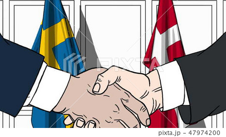 Businessmen or politicians shake hands against flags of Sweden and Denmark. Official meeting or 47974200