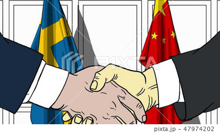 Businessmen or politicians shake hands against flags of Sweden and China. Official meeting or 47974202