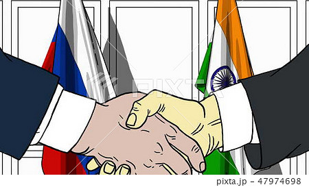 Businessmen or politicians shaking hands against flags of Russia and India. Meeting or cooperation 47974698