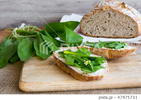 Sourdough bread with butter and wild garlic 47975731