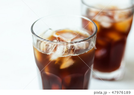 Coffee with ice on light background. Cold brew Coffee with ice on light background. Cold brew 47976189
