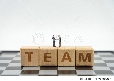 Miniature 2 people businessmen Shake hands on Miniature 2 people businessmen Shake hands on 47976507